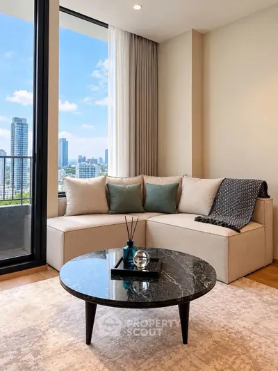 Modern living room with city view, featuring a stylish sofa and elegant coffee table.