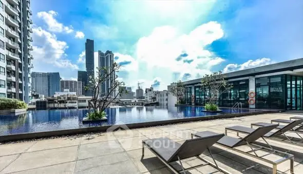 Luxurious rooftop pool with stunning city skyline views, perfect for relaxation and leisure in a modern urban setting.