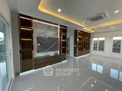 Luxurious modern living room with built-in shelves and elegant lighting