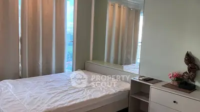 Cozy bedroom with large window and elegant decor