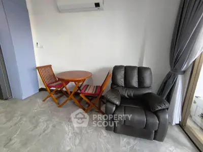 Cozy living room with modern recliner and stylish wooden furniture, perfect for relaxation.