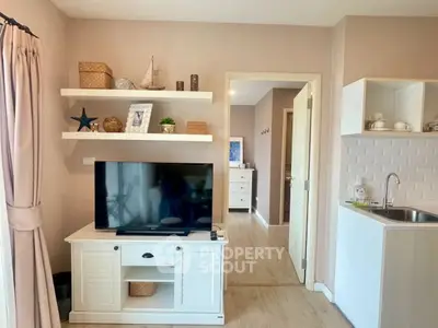 Charming living room with TV unit and open kitchen layout in cozy apartment