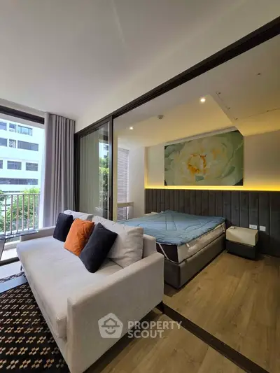Modern studio apartment with cozy living area and stylish decor