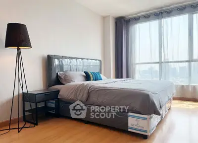 Modern bedroom with large window and stylish decor