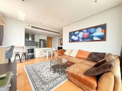 Spacious modern living room with open kitchen and stylish decor