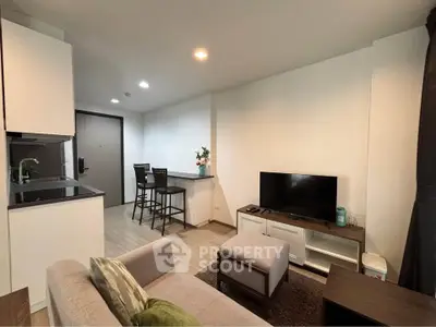 Modern living room with open kitchen and stylish decor