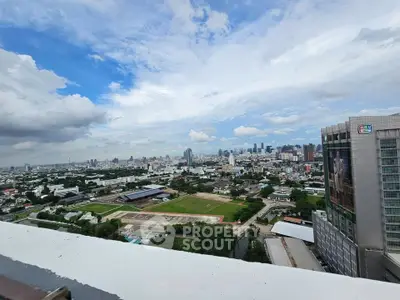Stunning cityscape view from high-rise building showcasing urban skyline and expansive horizon.