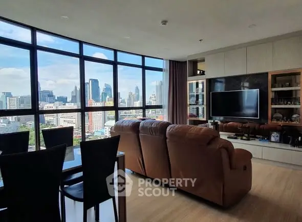 Spacious living room with stunning city view and modern furnishings