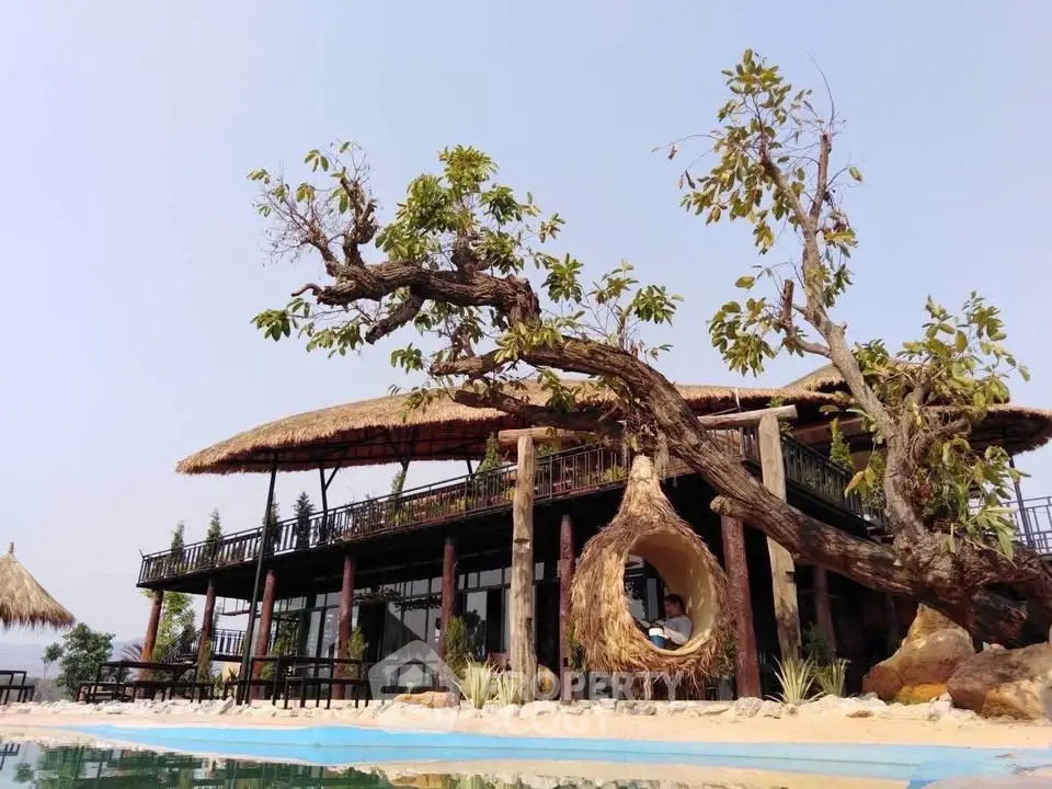 Stunning tropical resort with unique architecture and poolside view, perfect for luxury relaxation.