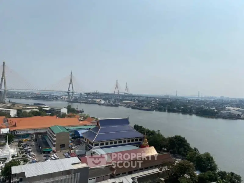 Stunning river view with iconic bridge and cityscape, perfect for urban living enthusiasts.