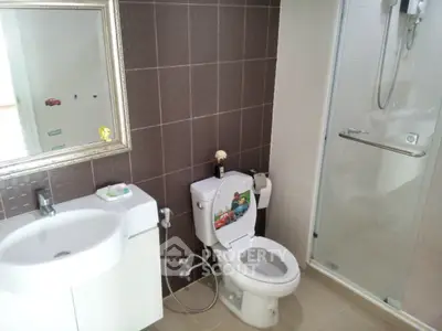 Modern bathroom with sleek fixtures and glass shower enclosure