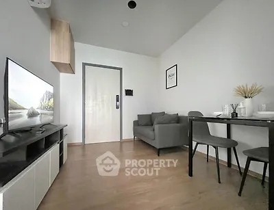 Modern living room with sleek furniture and stylish decor, perfect for urban living.