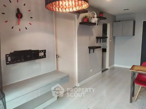 Modern interior with wall clock and sleek furniture in stylish apartment