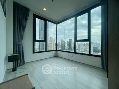 Spacious corner unit with panoramic city views and large windows, perfect for urban living.