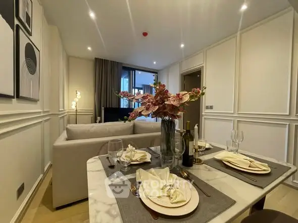 Elegant living room with dining area, modern decor, and cozy ambiance.