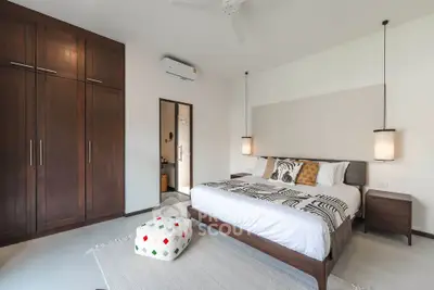 Spacious modern bedroom with elegant wooden furniture and stylish decor