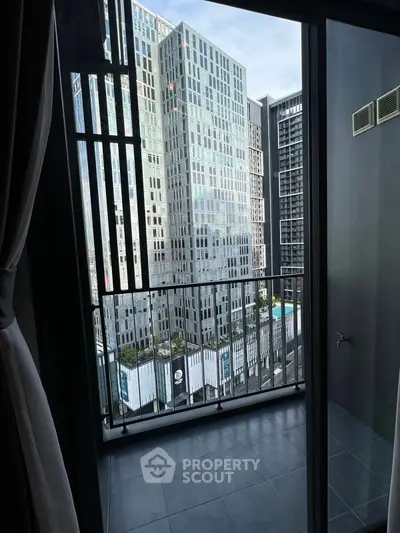 Modern city view from a sleek balcony in a high-rise apartment