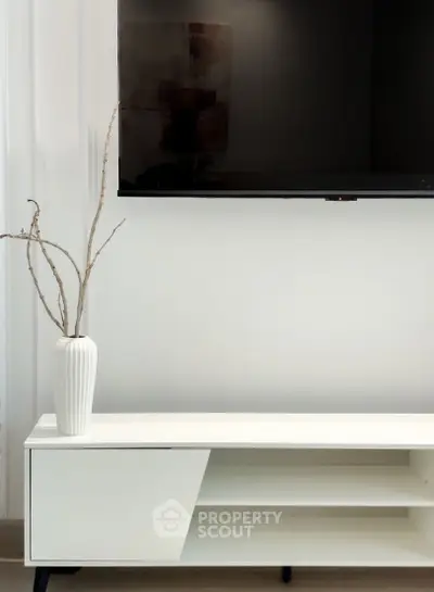 Modern living room with sleek TV setup and minimalist decor