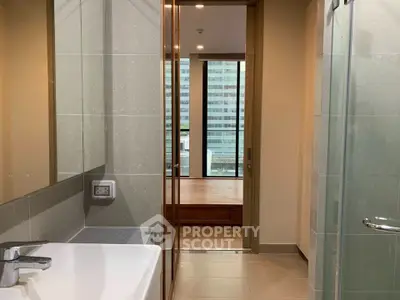Modern bathroom with sleek design and city view from window