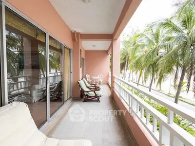 Spacious balcony with tropical view, perfect for relaxation and enjoying nature.