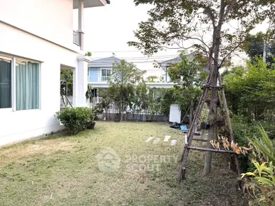 Charming garden view with lush greenery and modern house exterior