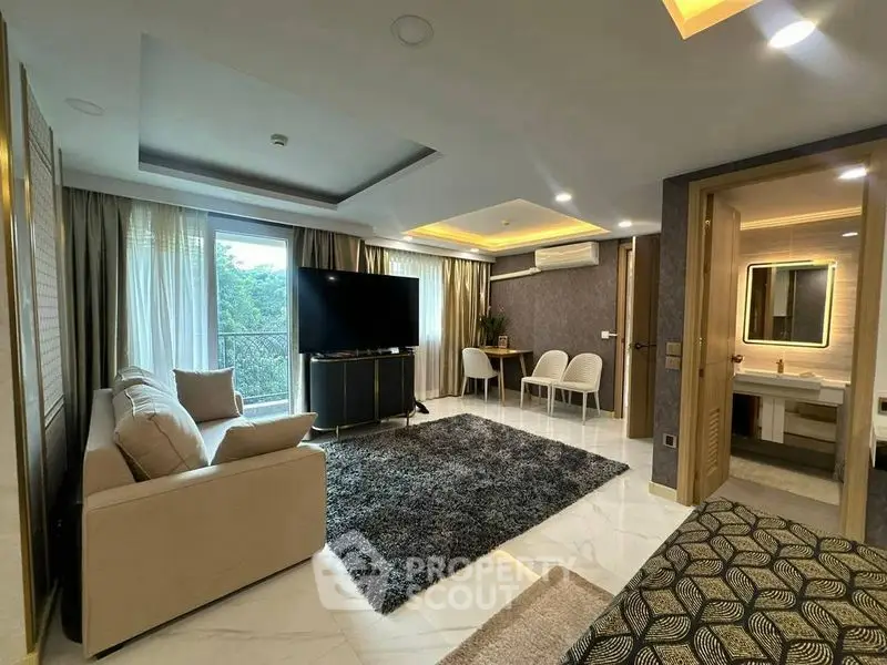 Luxurious modern living room with elegant decor and large windows offering natural light.