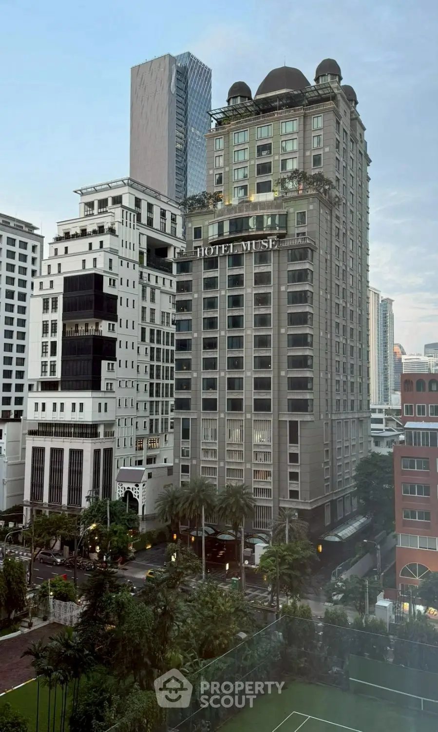 Stunning cityscape view featuring modern high-rise buildings and lush greenery, perfect for urban living.