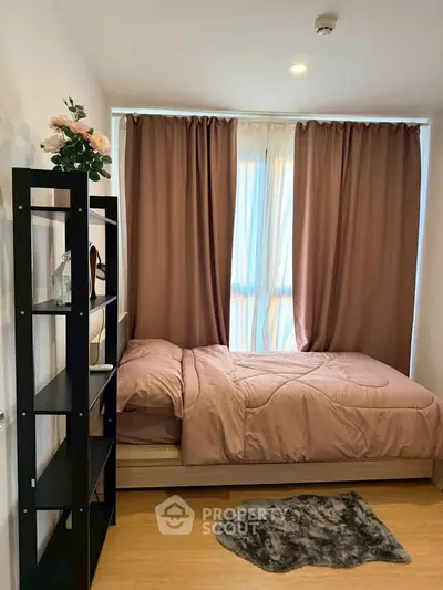 Cozy bedroom with elegant decor and natural light, perfect for relaxation and comfort.