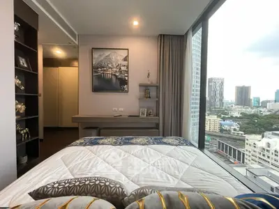 Luxurious bedroom with stunning city view and elegant decor in modern high-rise apartment.