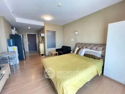 Spacious studio apartment with modern furnishings and open layout, ideal for urban living.
