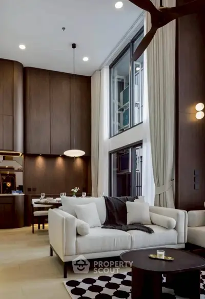 Luxurious modern living room with high ceilings and elegant decor
