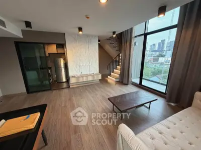 Spacious modern living room with large windows and city view