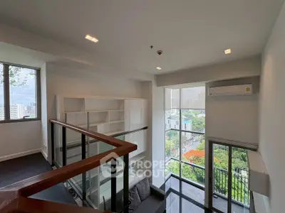 Modern loft apartment with large windows and city view