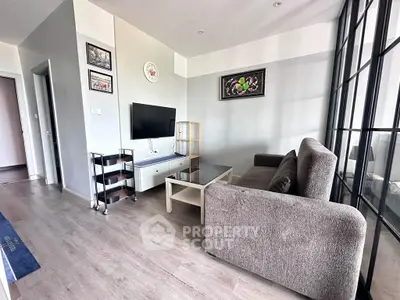 Modern living room with stylish decor and large windows in a contemporary apartment.