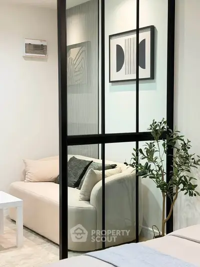 Modern living room with glass partition and stylish decor