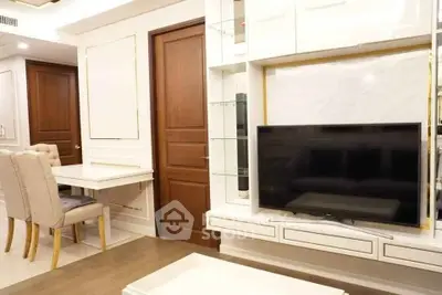 Modern living room with elegant dining area and built-in TV unit