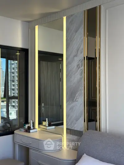 Elegant bedroom corner with modern decor and city view window