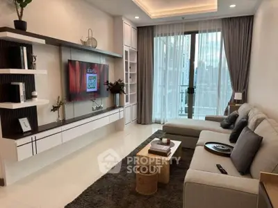 Modern living room with stylish decor and large window offering city view