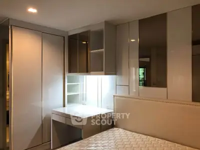 Modern bedroom with built-in wardrobe and sleek design