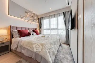 Luxurious bedroom with plush bedding and modern decor in high-rise apartment.