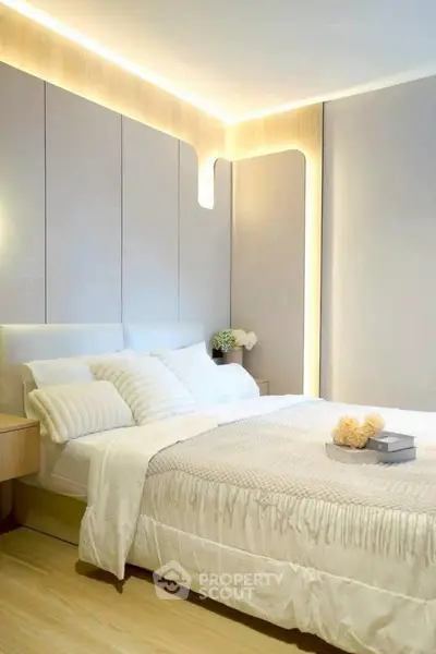 Elegant modern bedroom with stylish lighting and cozy decor