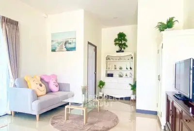 Bright and cozy living room with modern decor and plush seating