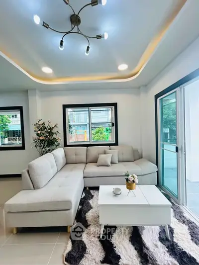 Modern living room with stylish lighting and cozy sectional sofa