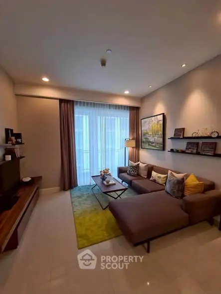 Stylish modern living room with cozy sectional sofa and large window for natural light.