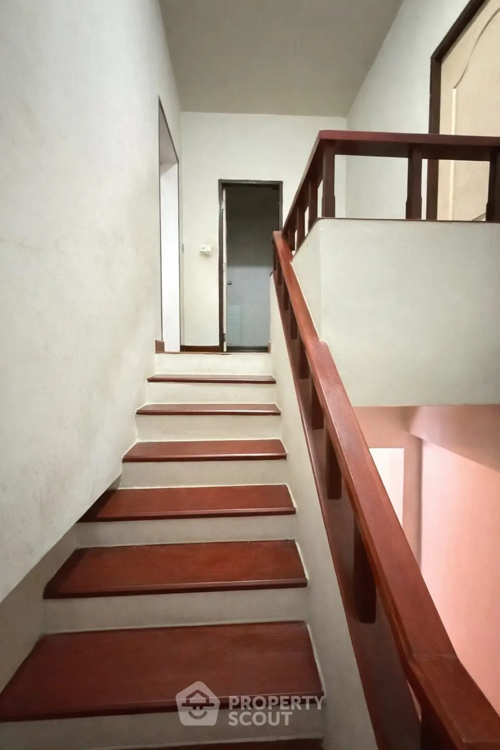 Elegant wooden staircase with sleek railing in modern home interior