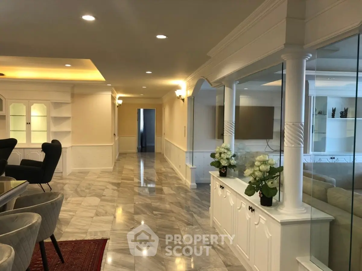 Luxurious open living space with elegant marble flooring and stylish decor