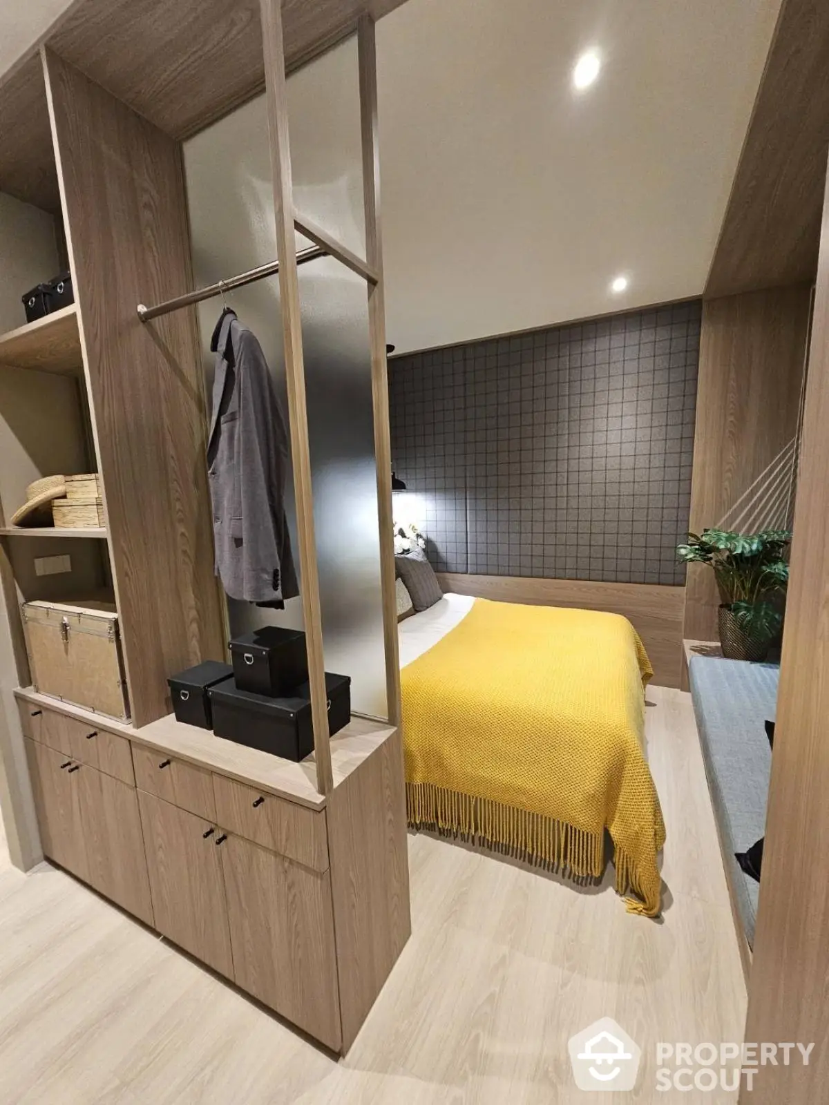 Modern bedroom with stylish wood paneling and cozy yellow bedding