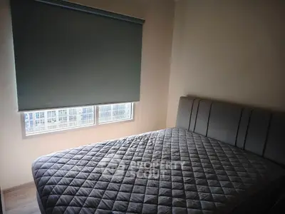 Cozy bedroom with modern bed and window view in stylish apartment