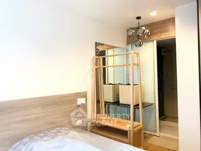 Modern bedroom with stylish decor and ample natural light