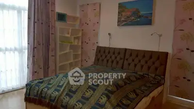 Cozy bedroom with stylish decor and natural light